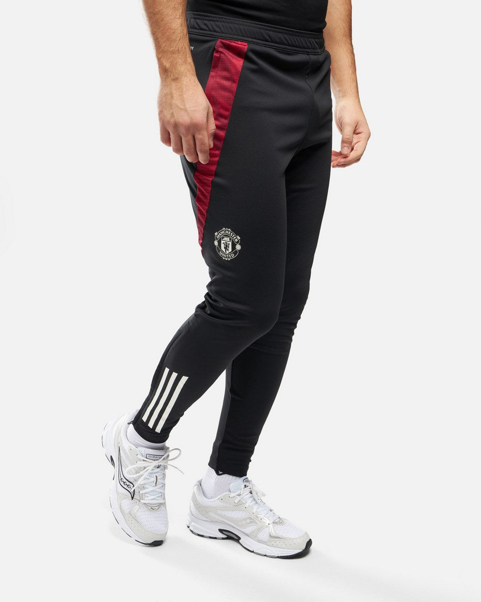 Pantalon d'entrainement Manchester United 2024/2025 - Noir/Rouge